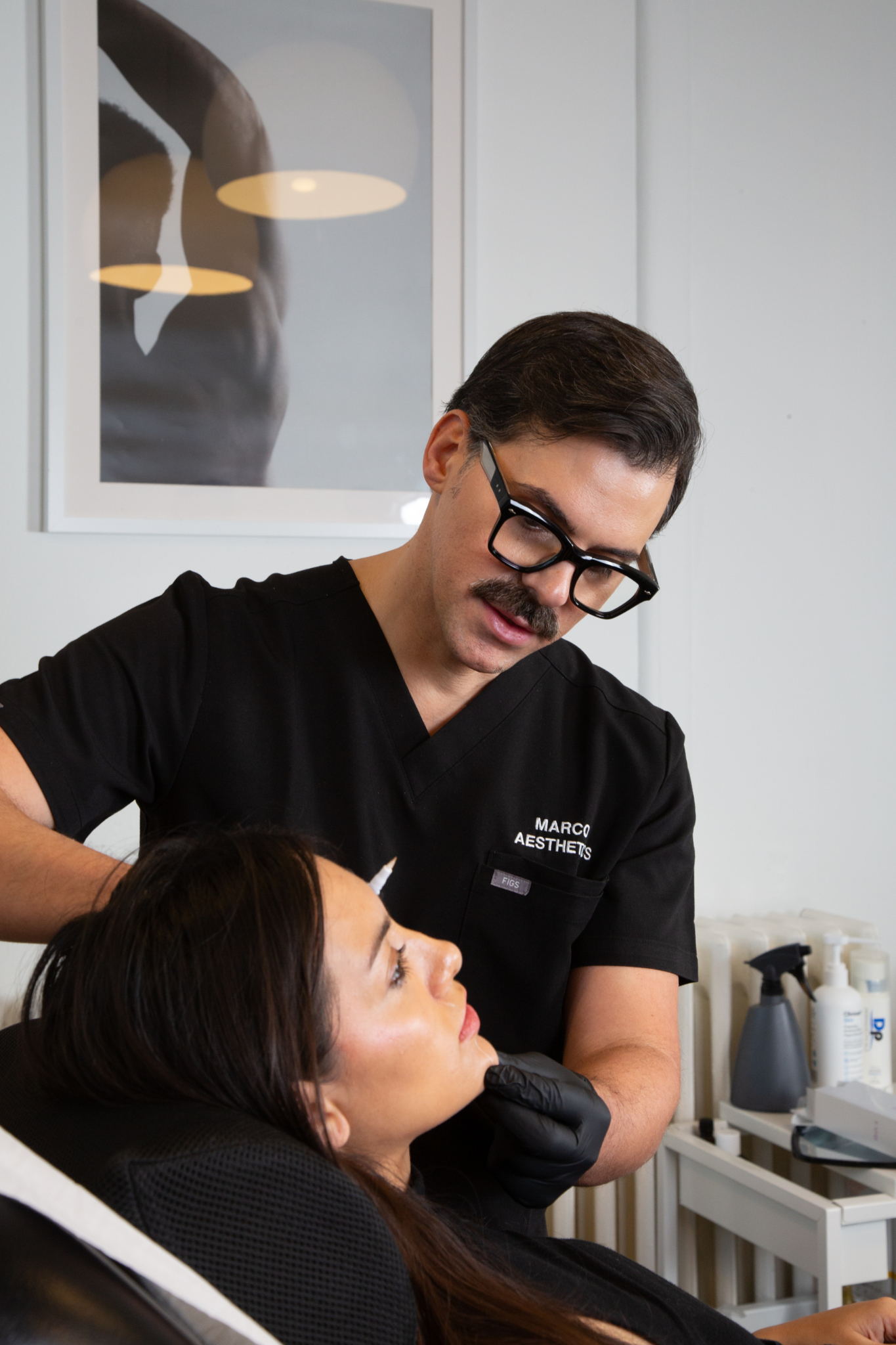 Marco prepares to administer chin botox on a client