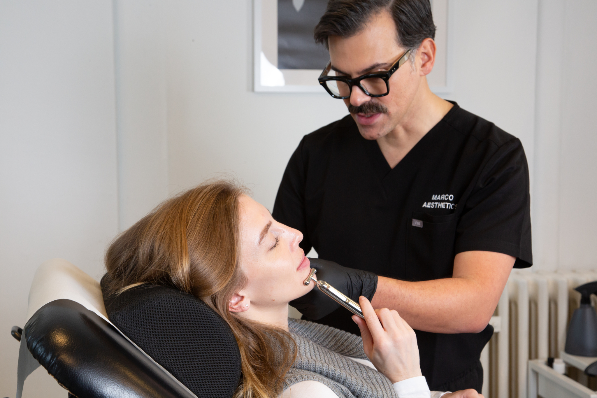Marco administers excessive teeth grinding botox treatment on a client