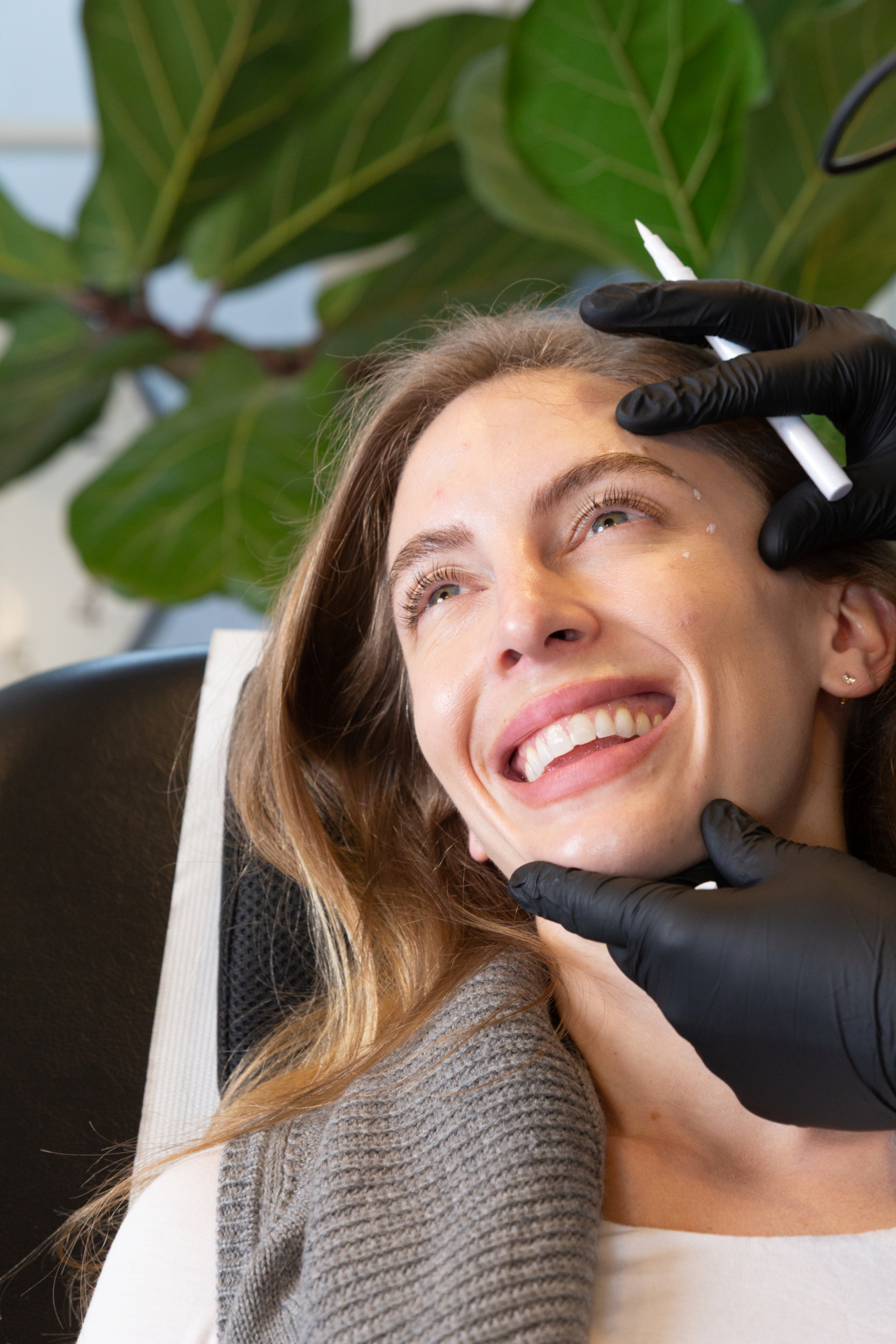 Marco administers botox shots on a client in his Shoreditch, London studio