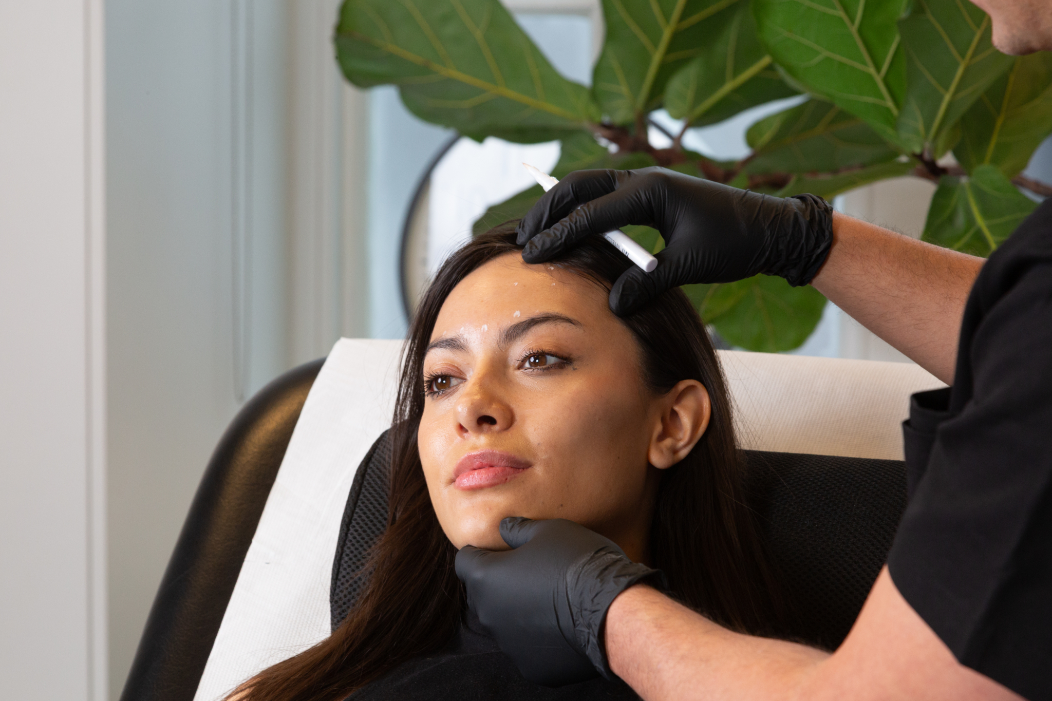 Marco prepares a client for botox for migraines