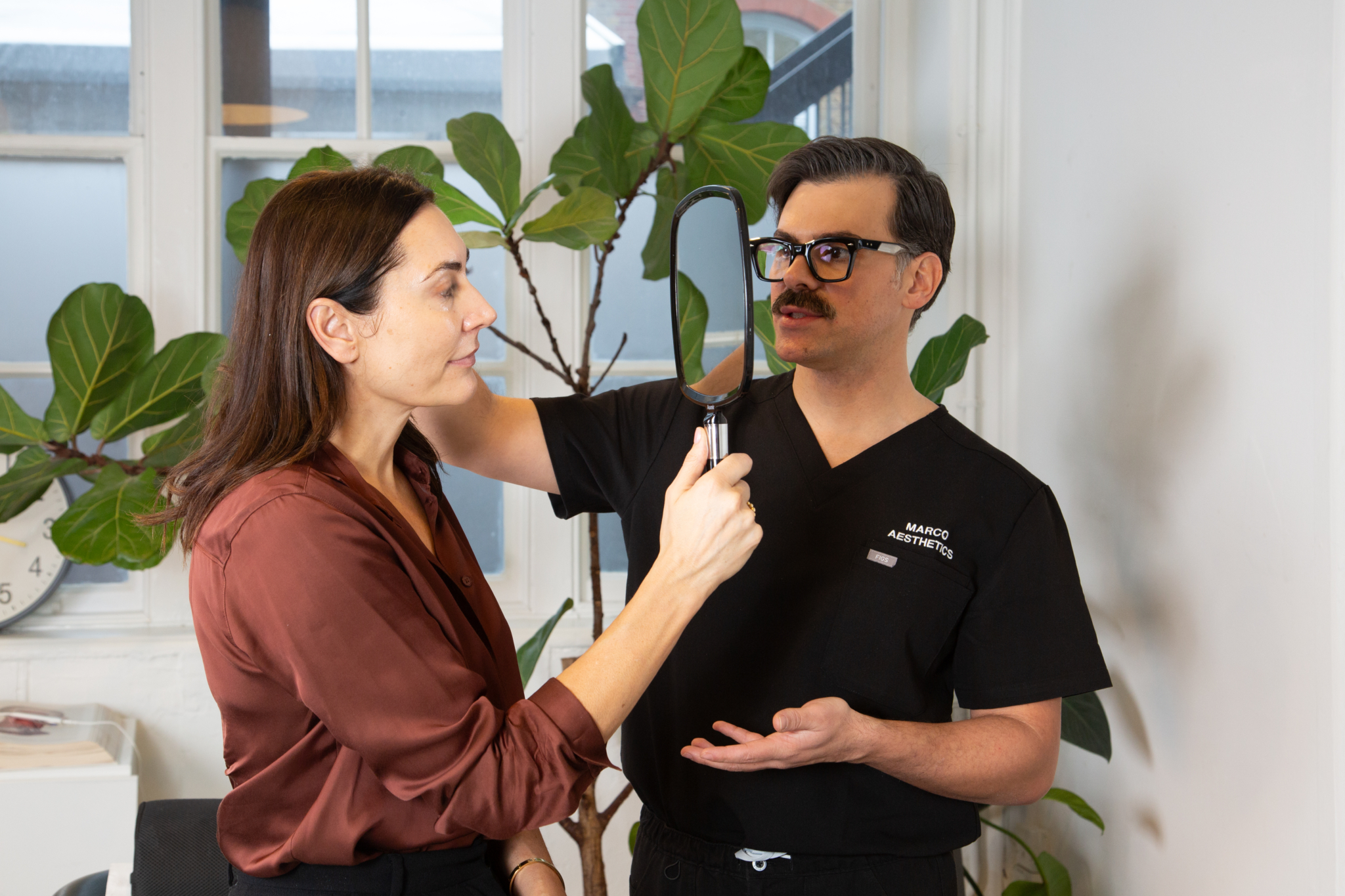 Marco discusses jowl filler with a client