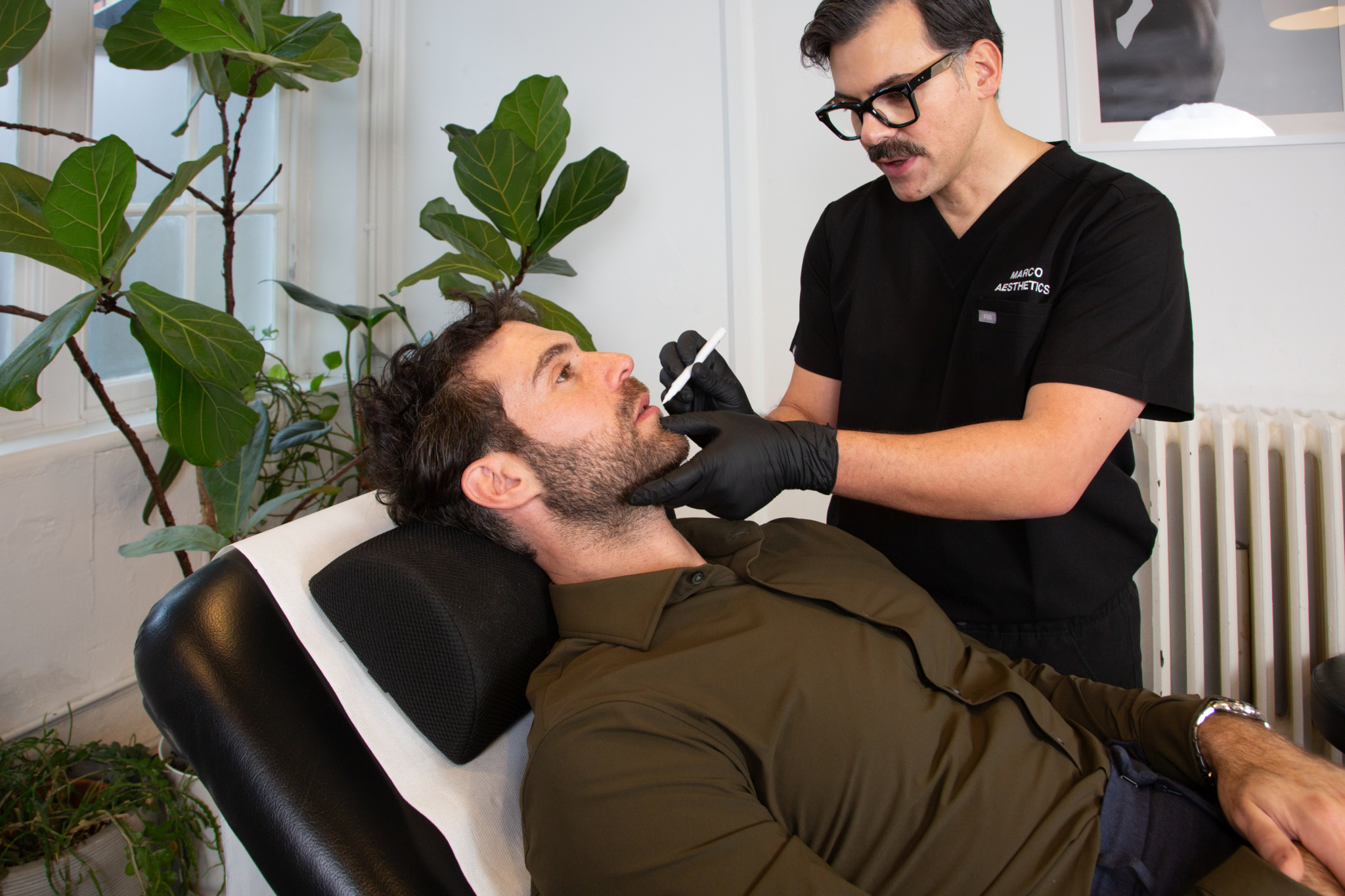 Marco prepares a male client for lip filler