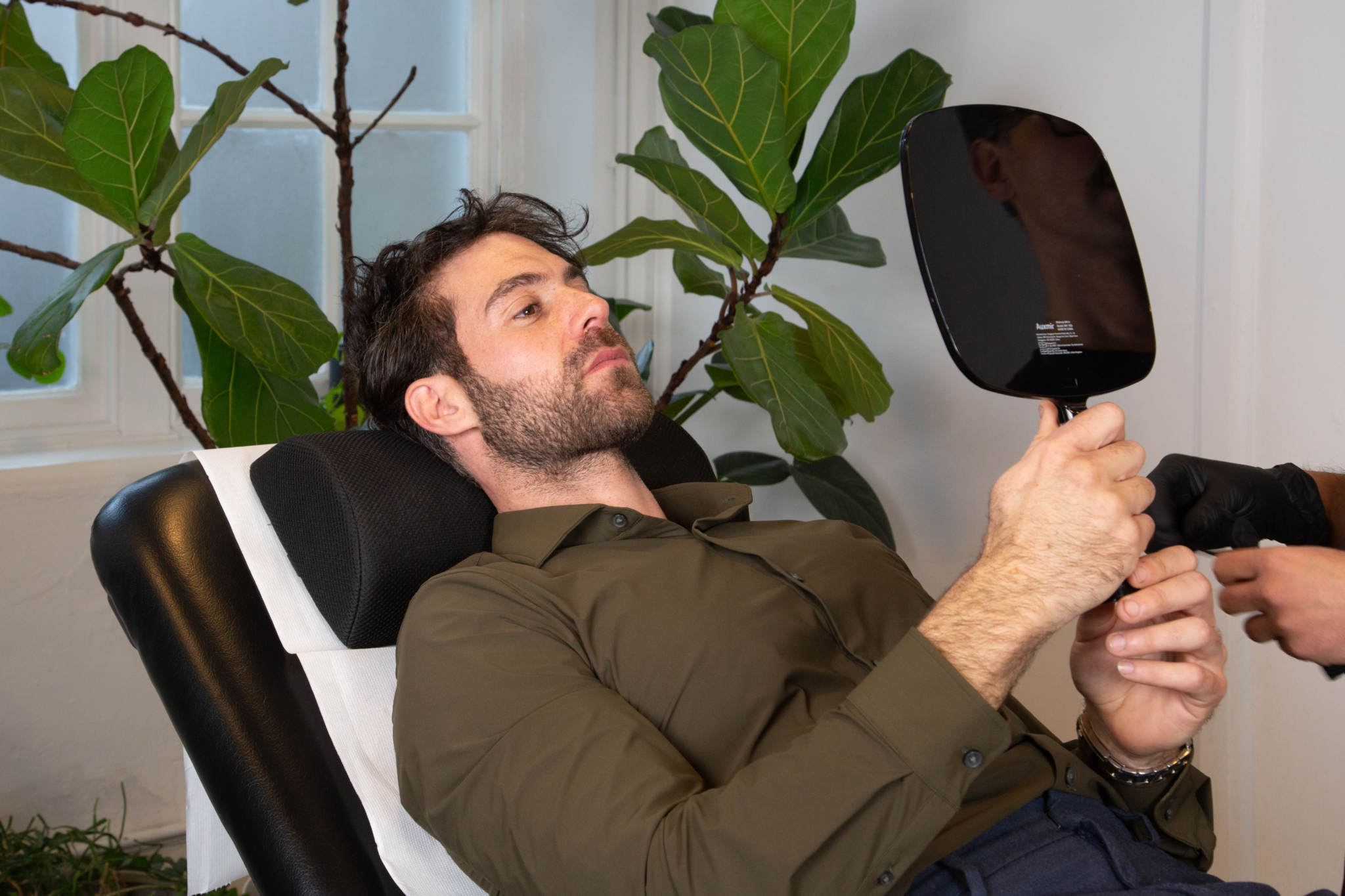 Marco discusses marionette lines filler with a male client