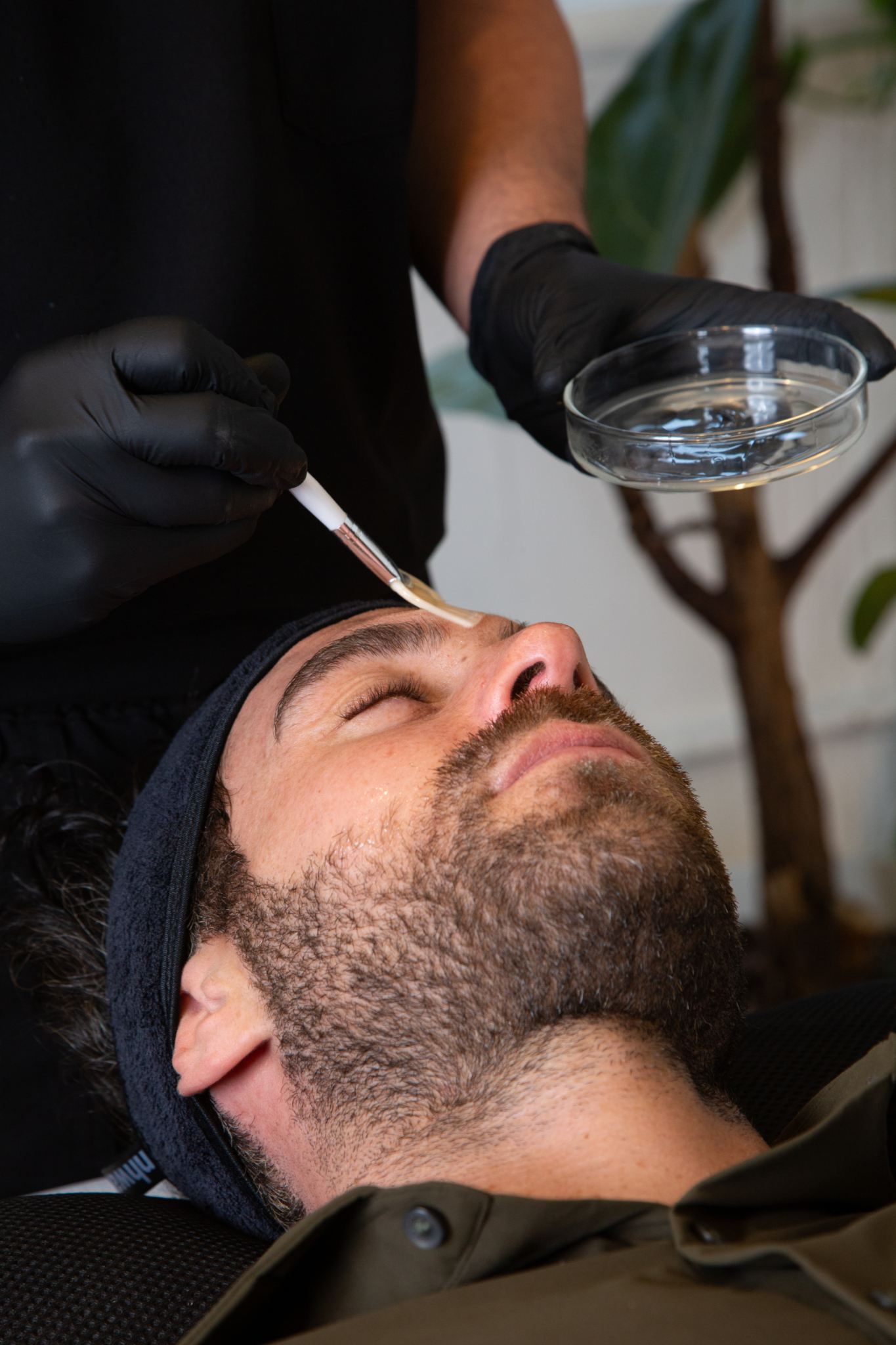 Marco prepares a client for their exosomal therapy treatment