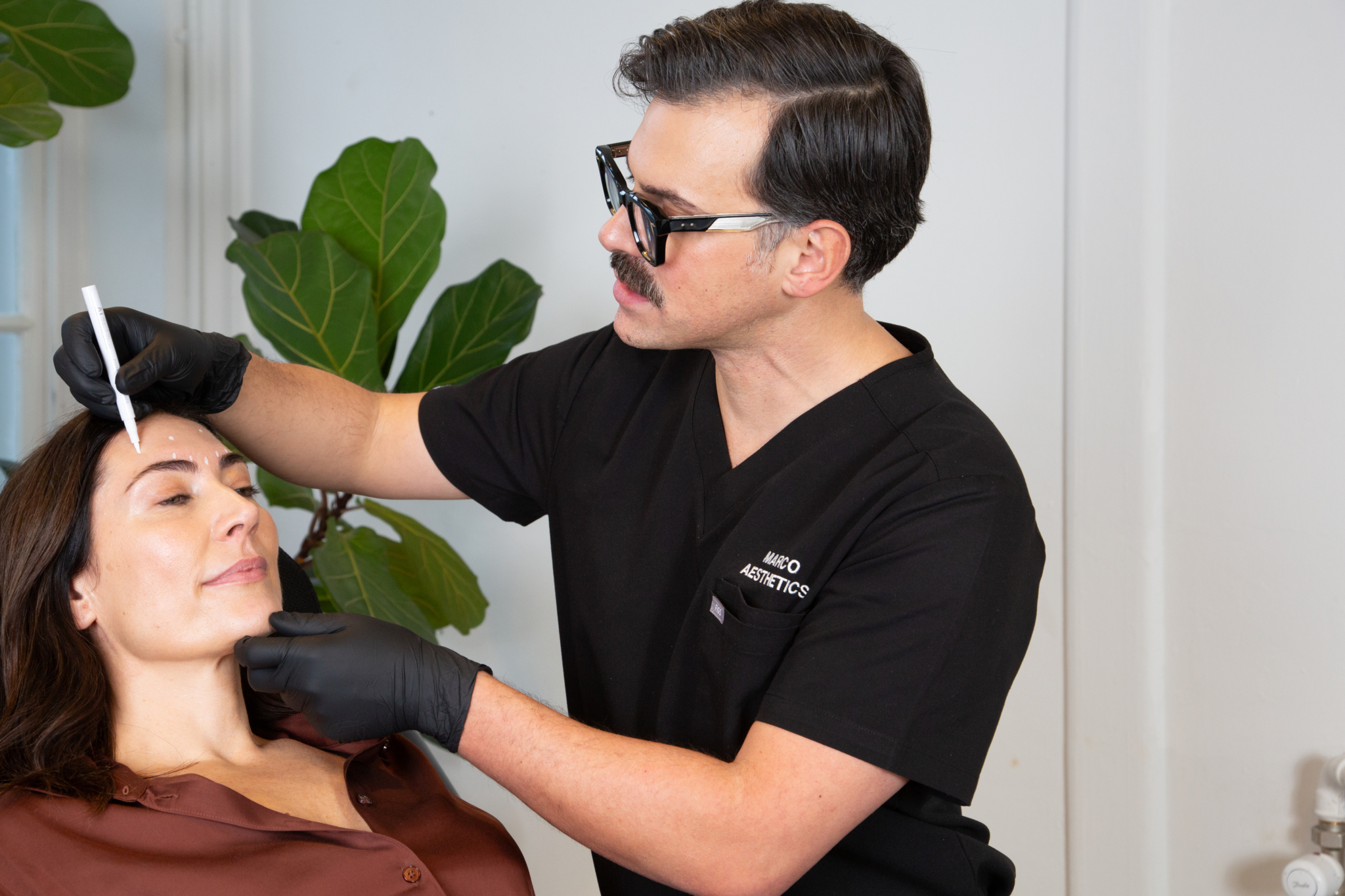 Marco prepares a client for their polynucleotides treatment