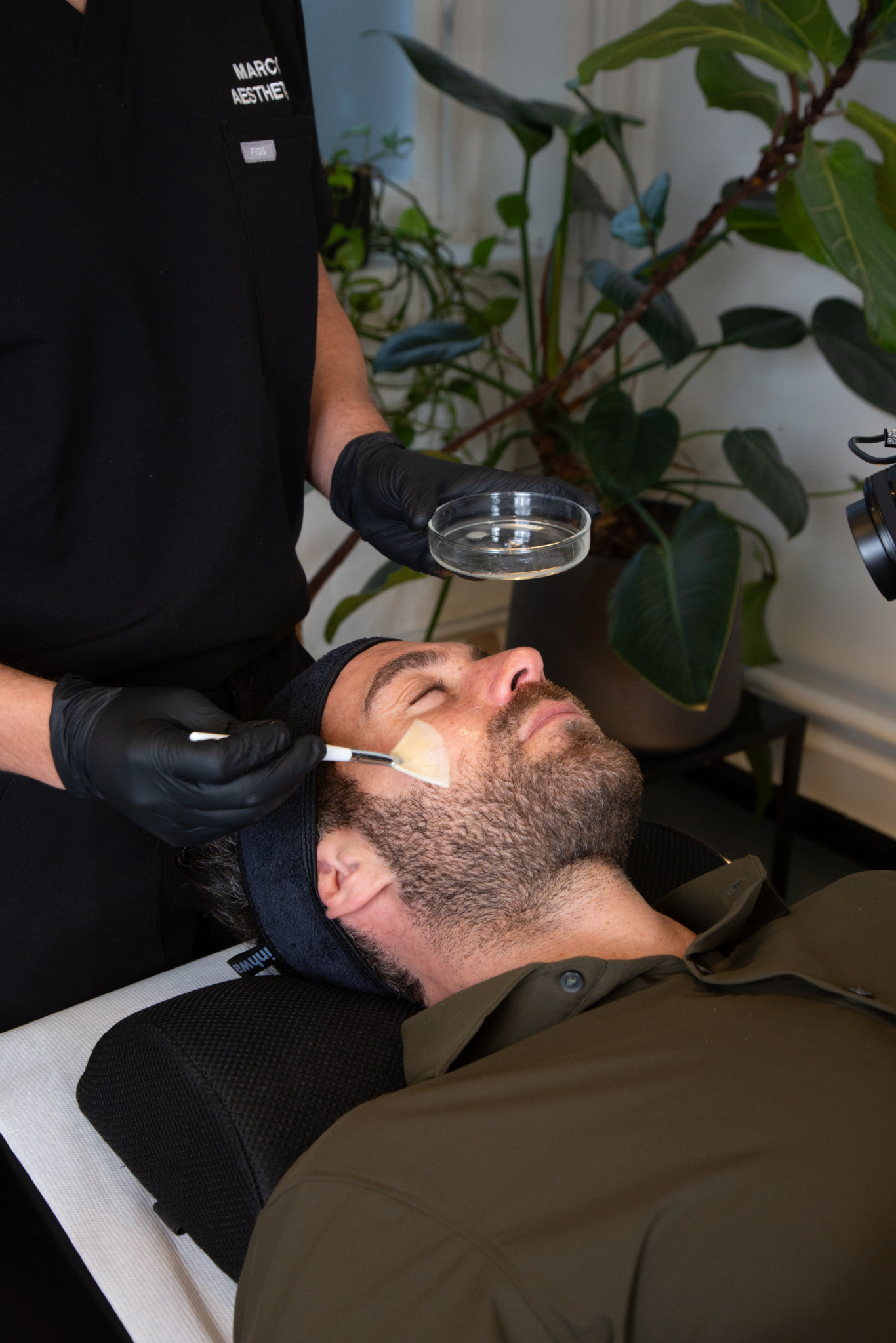 Marco prepares a male client in his Shoreditch, London studio for skin rejuvenation treatment