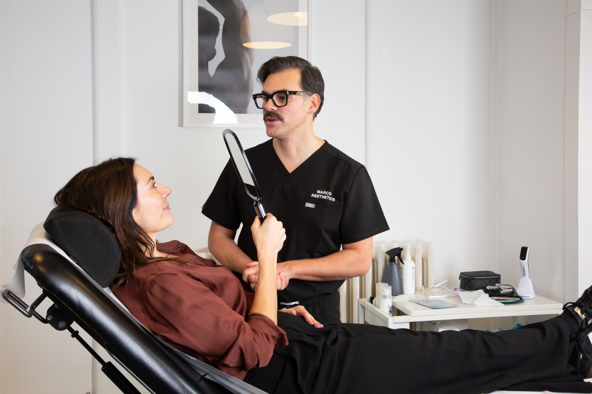 Marco discusses the results of his Sunekos treatment with a client