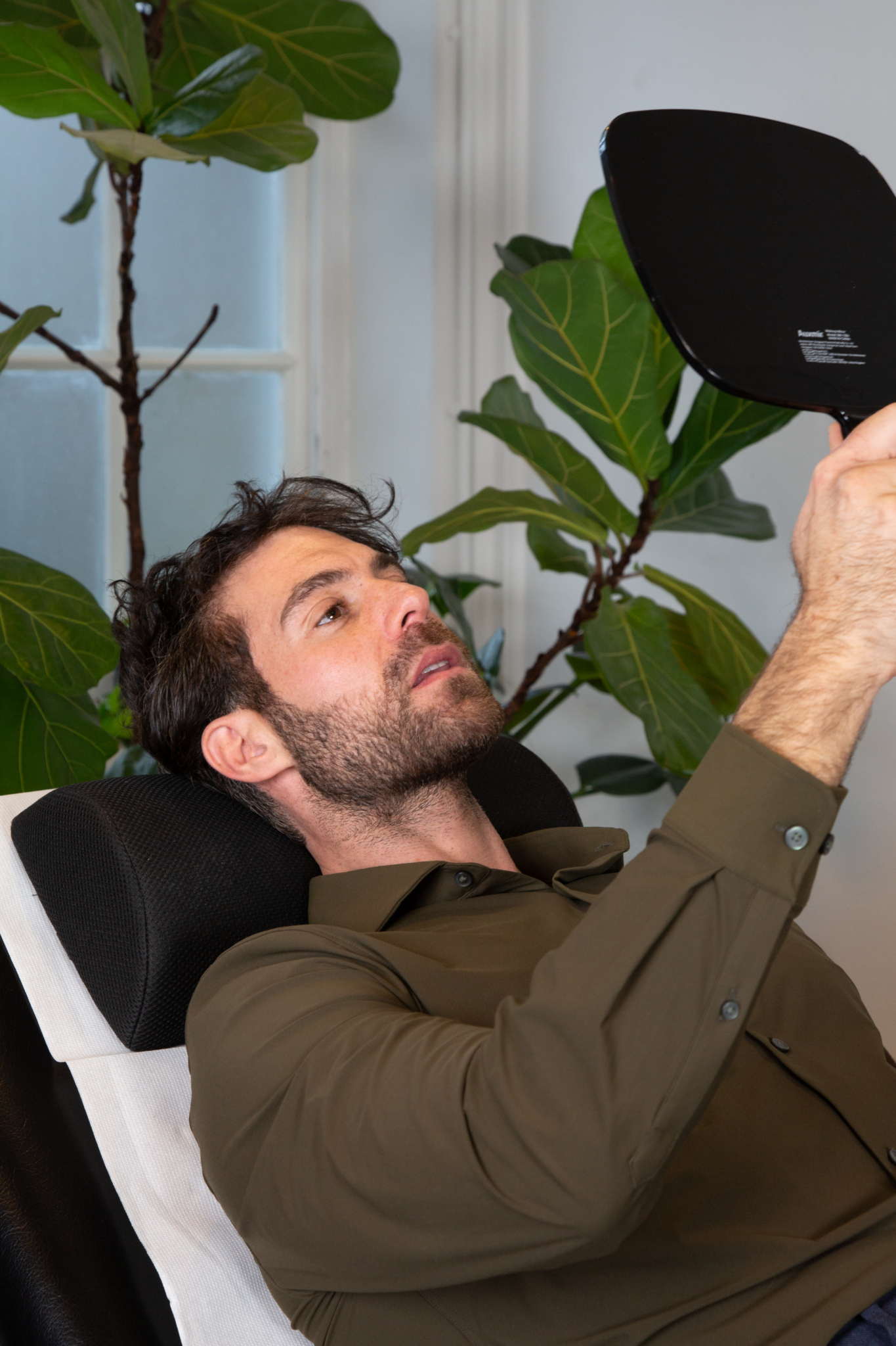 Marco discusses the results of tear trough filler with a male client