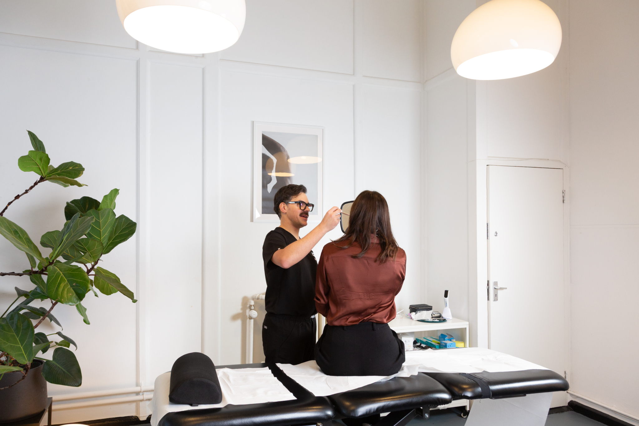 Marco discusses temple filler with a client